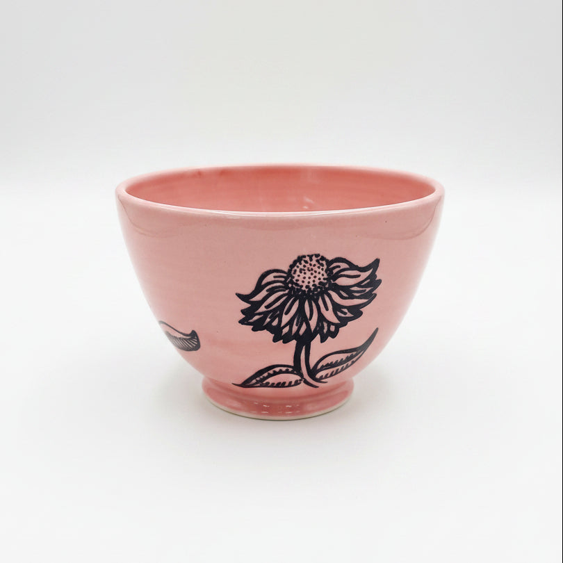 Bol rose avec fleurs noires